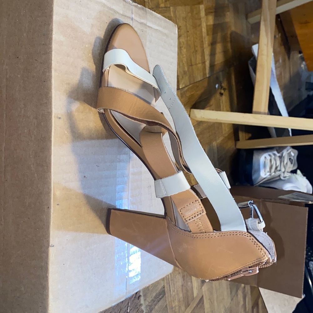 This is a brown and white leather shoe from Audrey Brooke